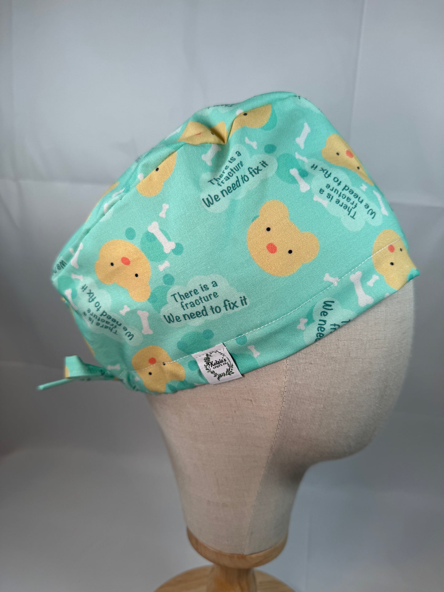 There is a Fracture We Need to Fix It Scrub Cap - Satin Lining Available - Multiple Styles