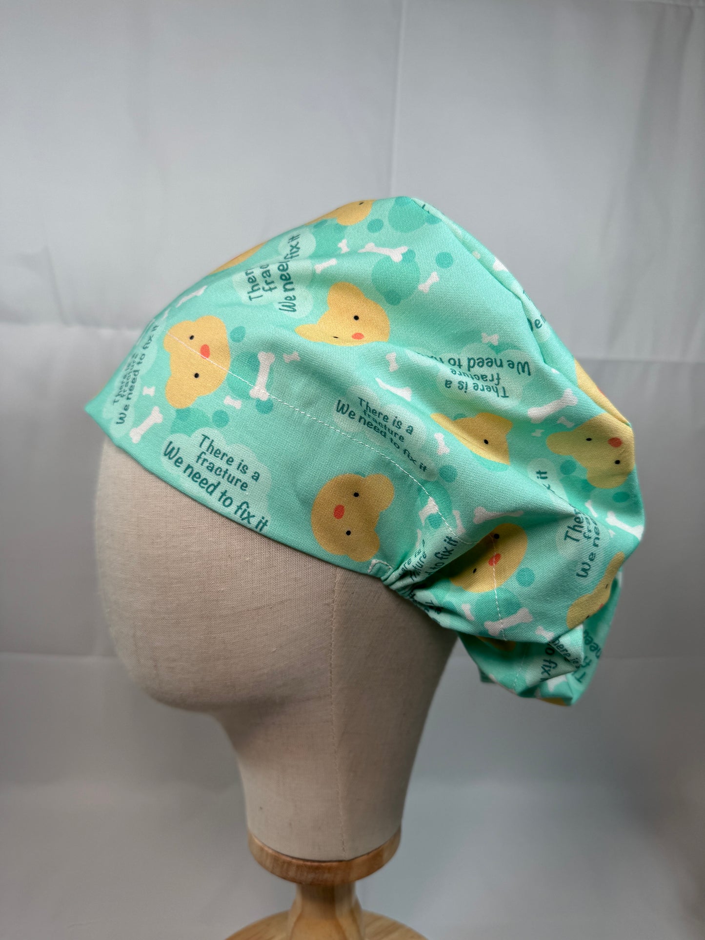 There is a Fracture We Need to Fix It Scrub Cap - Satin Lining Available - Multiple Styles