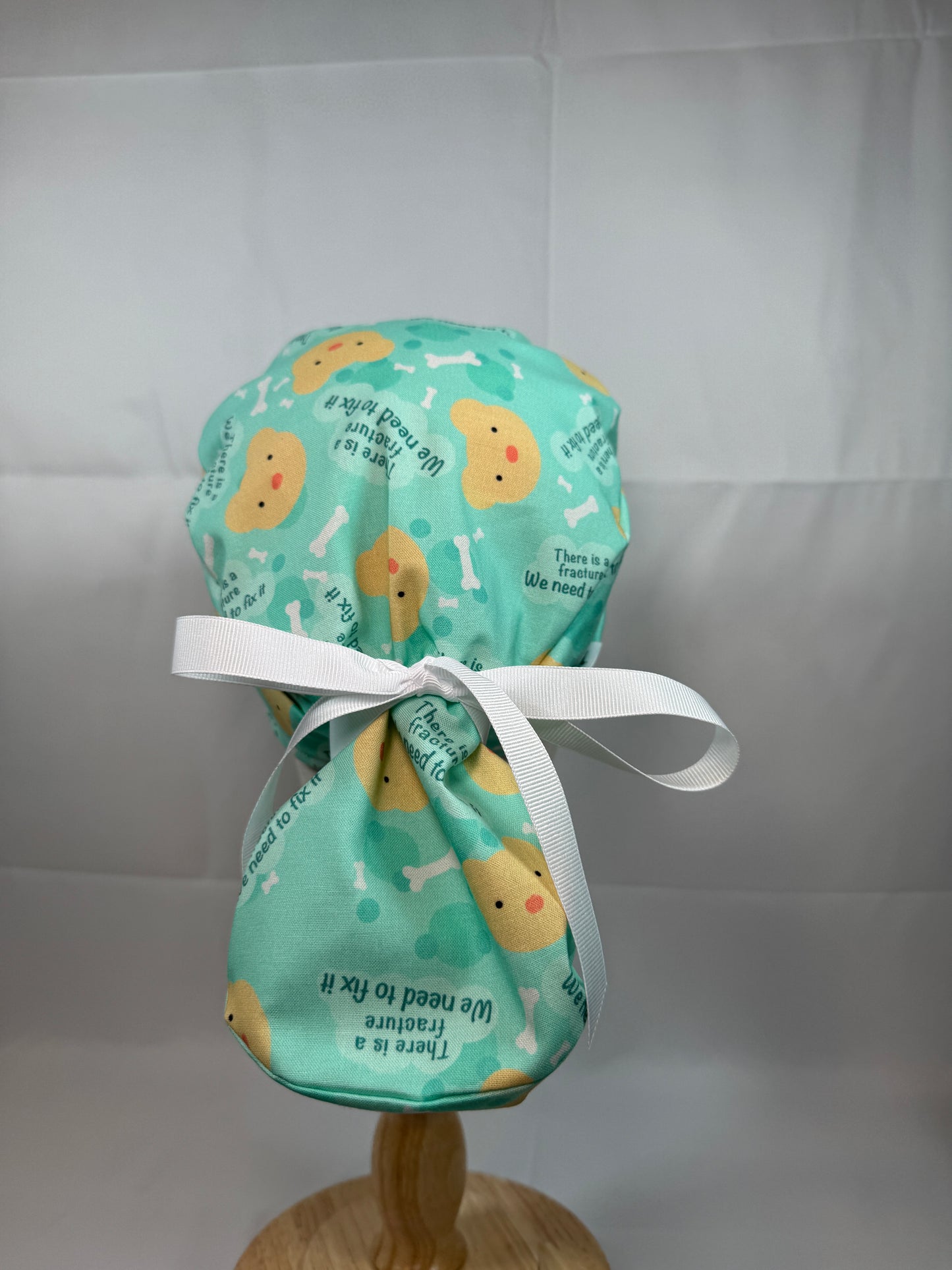 There is a Fracture We Need to Fix It Scrub Cap - Satin Lining Available - Multiple Styles